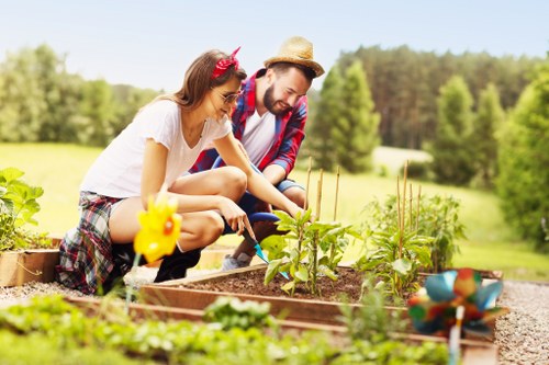 Garden landscaping ideas for a Sudbury home with planting and paved seating area